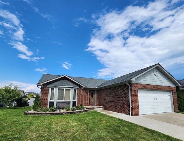 ranch-style home featuring a garage, driveway, brick siding, and a front lawn