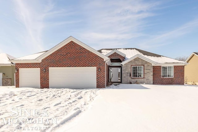 ranch-style home with brick siding and an attached garage