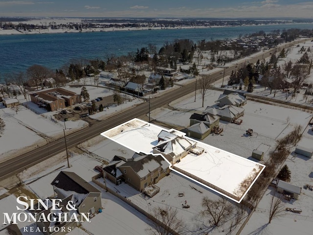 birds eye view of property featuring a water view