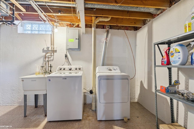 laundry area with laundry area, electric panel, and separate washer and dryer