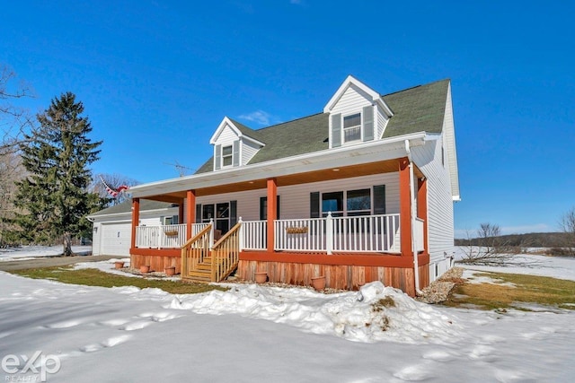 view of front facade featuring a porch and an attached garage