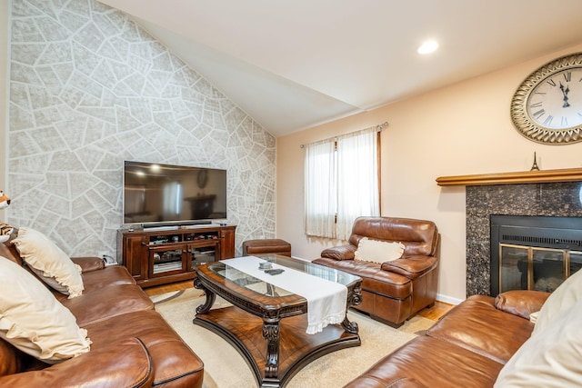 living room with lofted ceiling, a fireplace, recessed lighting, and wood finished floors