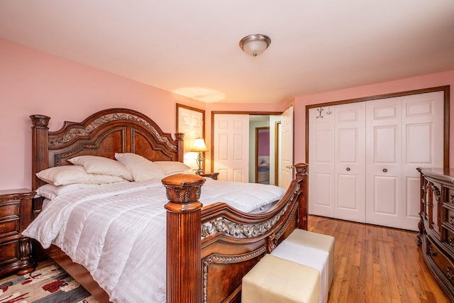 bedroom featuring a closet and light wood-style floors