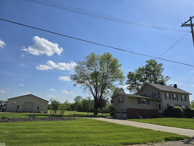 view of home's exterior featuring driveway, a lawn, and an attached garage