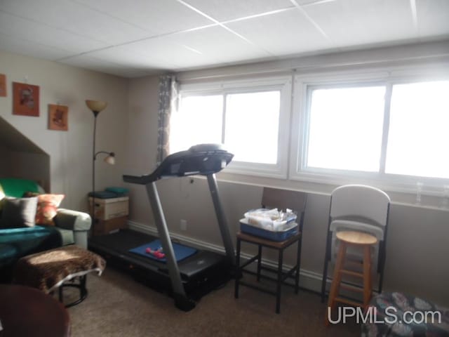 workout area with a drop ceiling and plenty of natural light