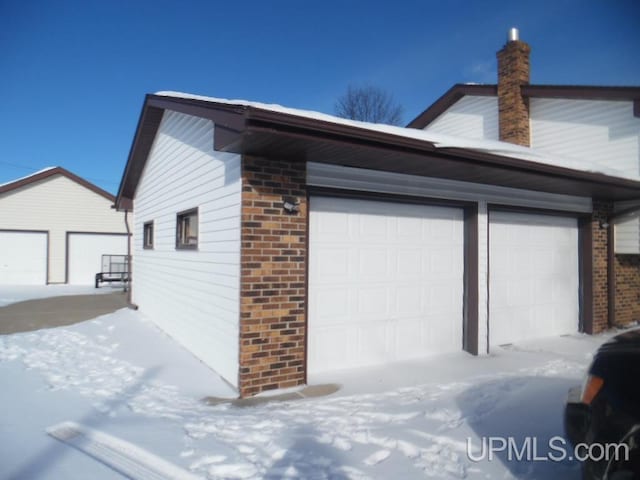 view of snow covered garage