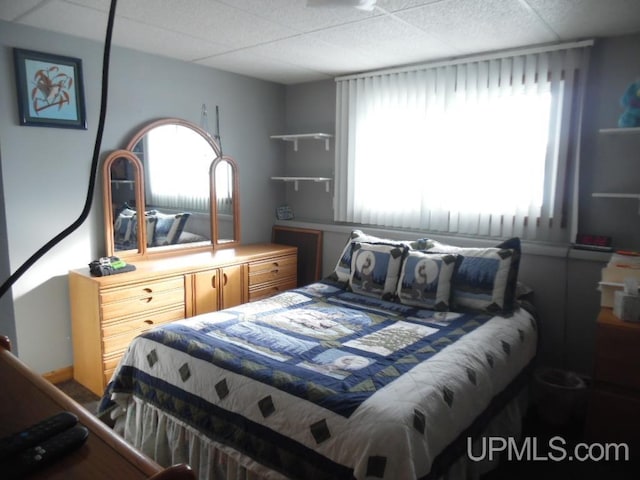 bedroom with a drop ceiling