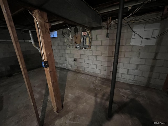 unfinished basement featuring electric panel