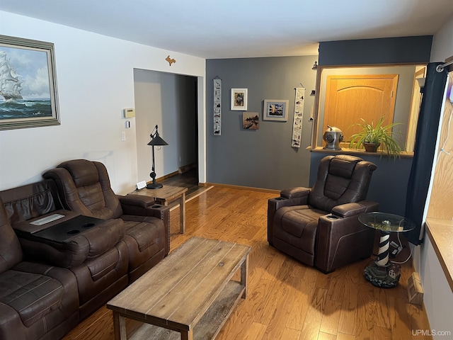 living room with wood finished floors and baseboards