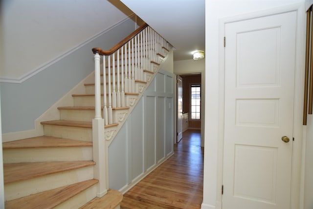 staircase featuring wood finished floors