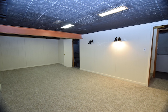 finished basement with visible vents and carpet flooring