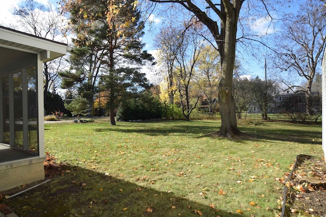 view of yard featuring a sunroom