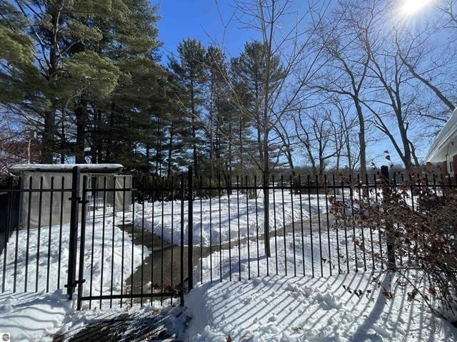 view of snow covered gate