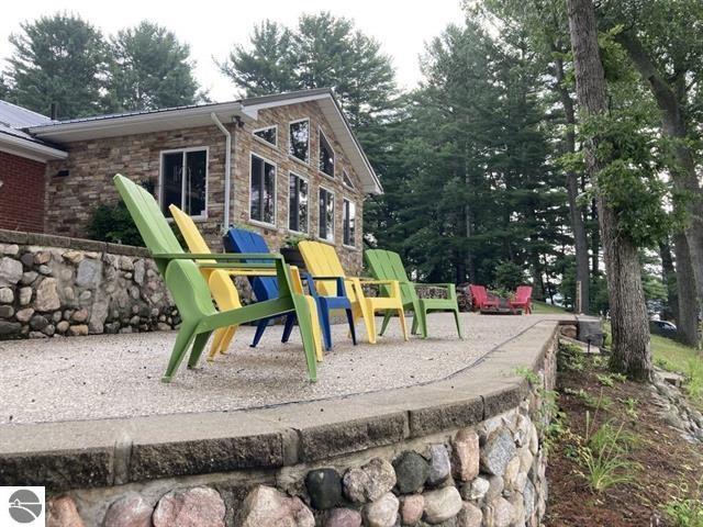 7836 W Perch Lake Dr, Lake, MI 48632 - view of playground featuring a patio area