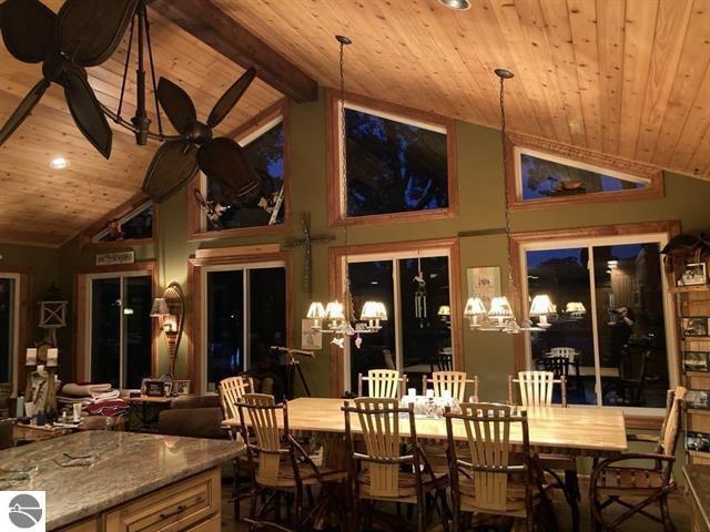 interior space with vaulted ceiling with beams and wooden ceiling