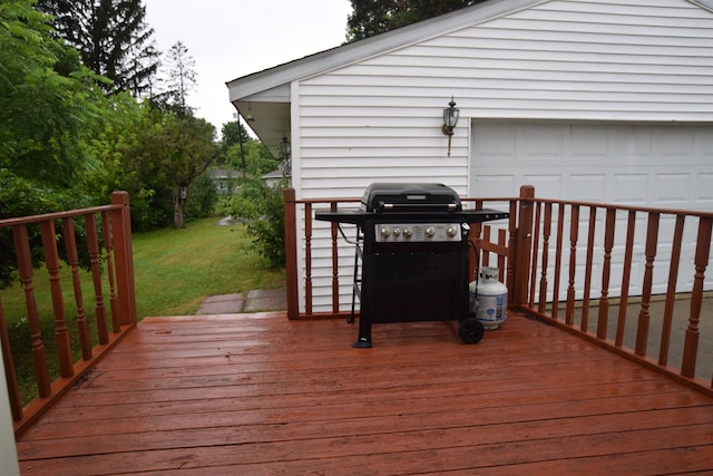 wooden terrace with a grill