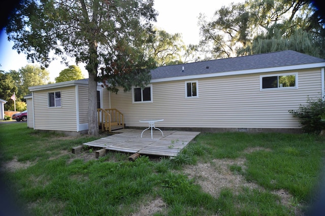 back of house with a yard and a wooden deck