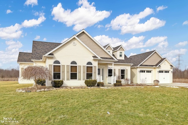 view of front of home featuring an attached garage, driveway, a front lawn, and roof with shingles