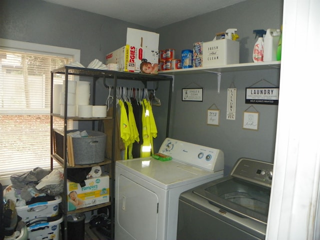 laundry room with laundry area and washer and clothes dryer