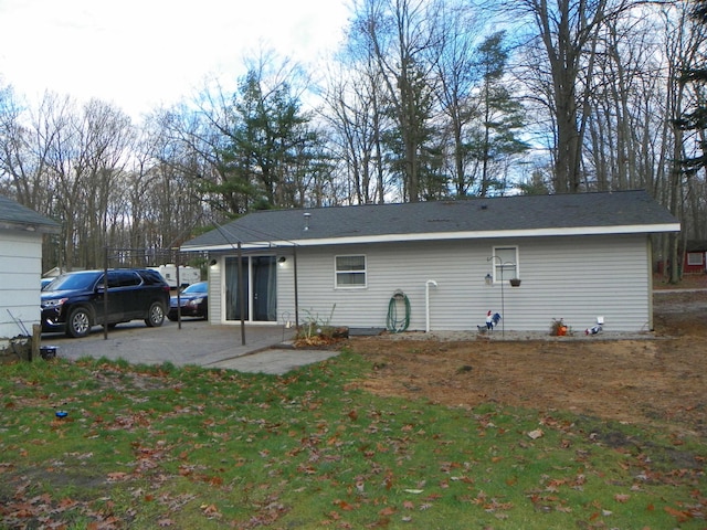 rear view of property with a patio area and a yard