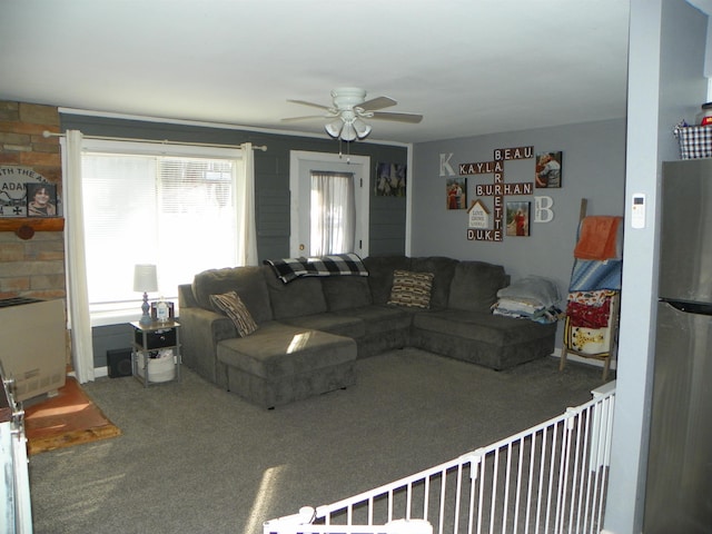 living room with carpet flooring and ceiling fan