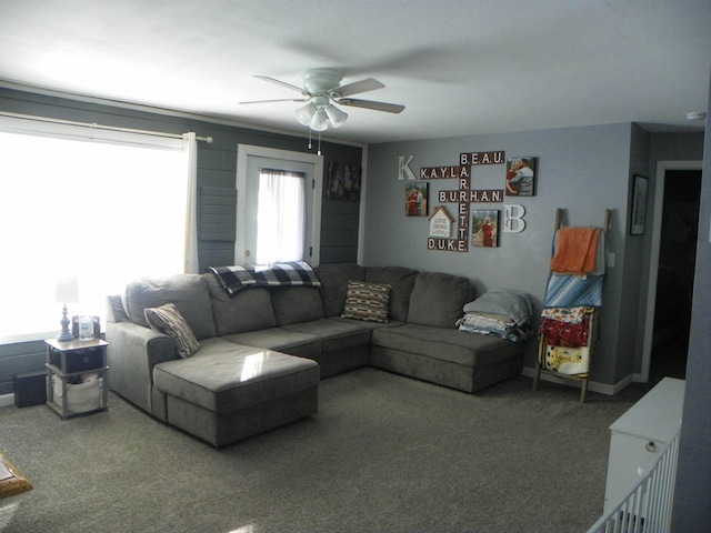 living room with carpet and a ceiling fan