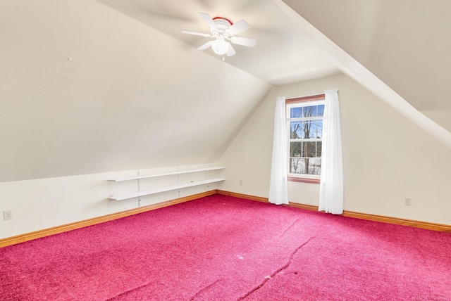 bonus room featuring a ceiling fan, carpet, vaulted ceiling, and baseboards