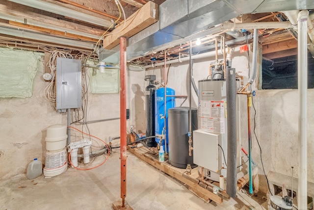 utility room featuring electric panel and gas water heater