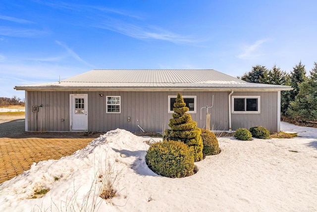 ranch-style home with metal roof