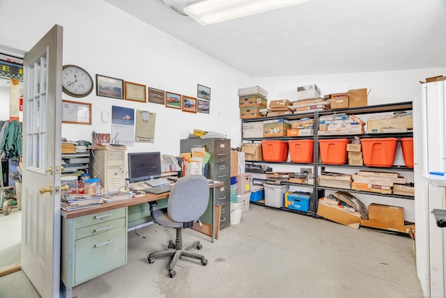 home office with concrete flooring