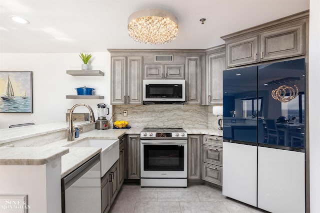 kitchen featuring open shelves, appliances with stainless steel finishes, visible vents, and decorative backsplash