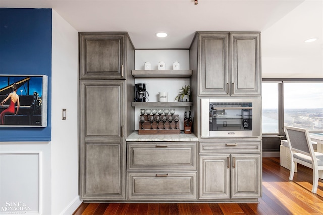 bar with recessed lighting, dark wood finished floors, and baseboards