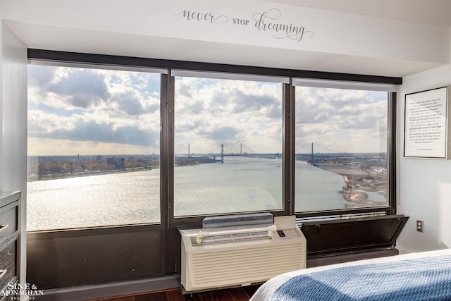 bedroom featuring a water view