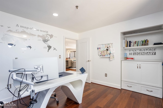 office space with baseboards and dark wood-type flooring