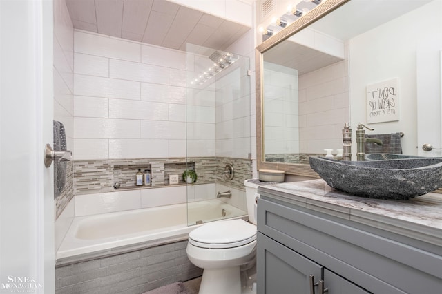 bathroom with toilet, shower / washtub combination, and vanity