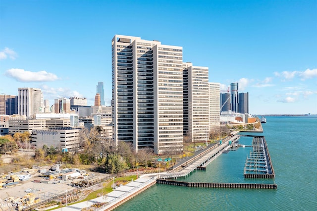 birds eye view of property featuring a view of city and a water view