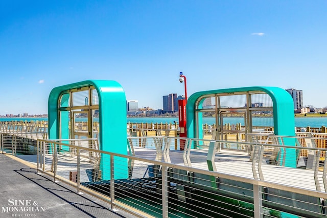 exterior space featuring a water view and a city view