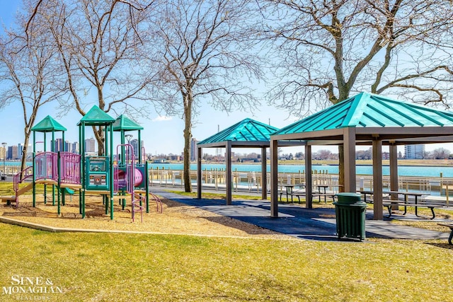 community jungle gym featuring a lawn and a gazebo