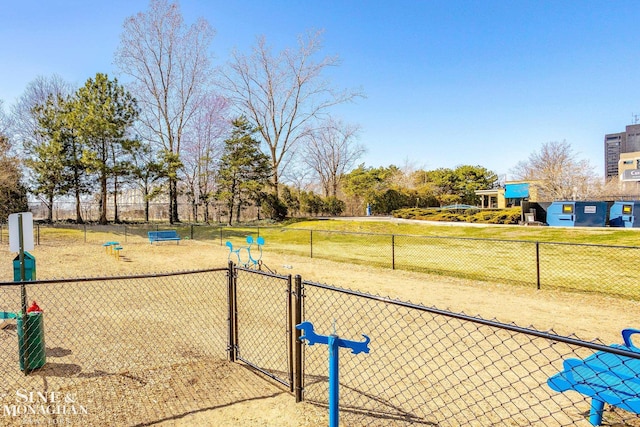 view of home's community with a gate and fence