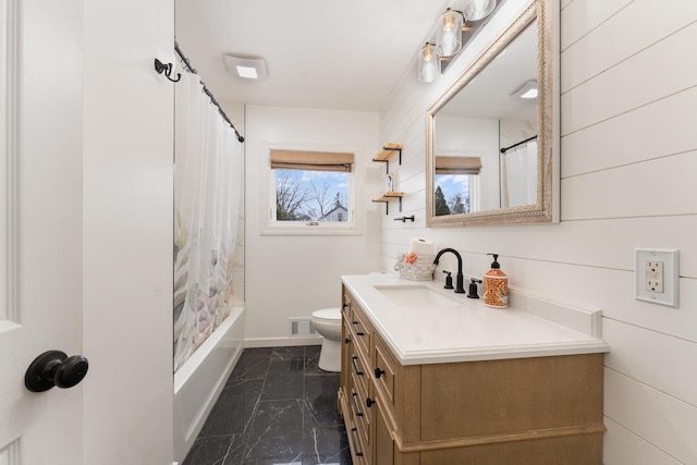 full bathroom featuring marble finish floor, shower / bath combination with curtain, visible vents, toilet, and vanity