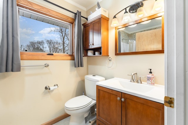 full bathroom with ornamental molding, vanity, toilet, and baseboards