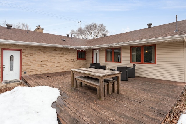 wooden deck featuring outdoor dining area