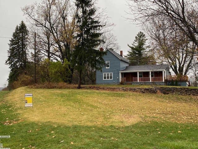 view of yard with covered porch