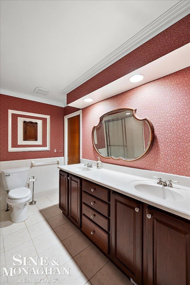 full bath with wallpapered walls, crown molding, tile patterned flooring, and a sink