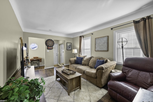 living room with dark wood-style floors and baseboards