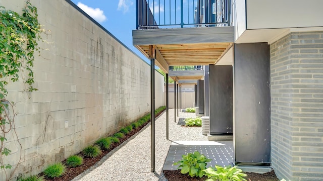 view of patio / terrace with fence and a balcony