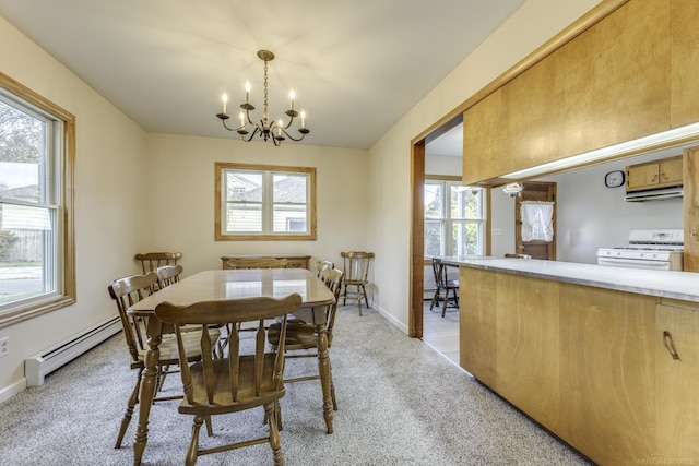 dining room featuring baseboards, light colored carpet, baseboard heating, and an inviting chandelier