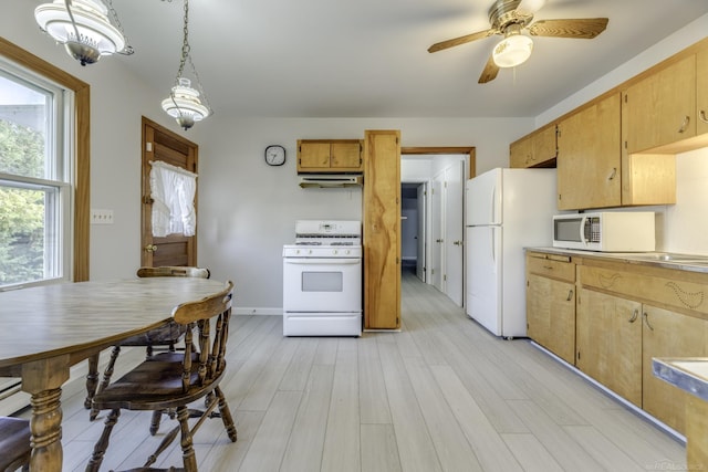 kitchen with under cabinet range hood, white appliances, a ceiling fan, light wood-style floors, and light countertops