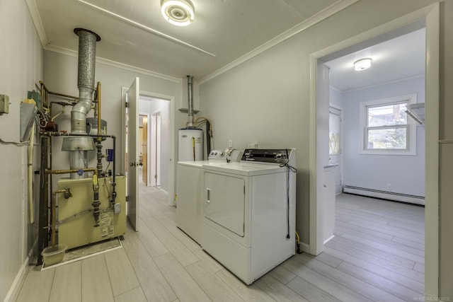 laundry area featuring a baseboard heating unit, laundry area, separate washer and dryer, light wood-style floors, and crown molding