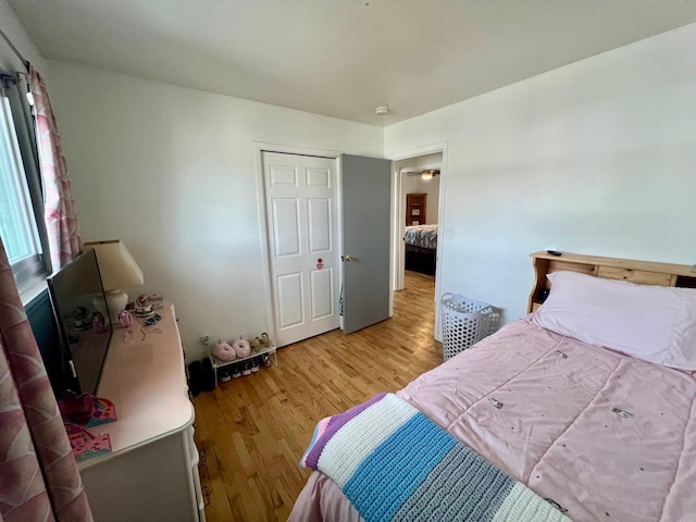 bedroom with light wood finished floors